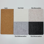 Materialmuster für die SKÅDIS Ablage mit Rand: Kork und Filz in Weiß, Beige, Hellgrau und Schwarz